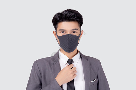身着面罩的年轻亚洲商务人士穿着防护面具 在白色背景上与世隔绝 手握颈领带 对大流行冠状病毒进行检疫 新常态等保护性隐形生物19人图片