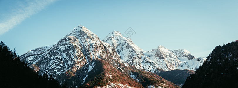 奥地利阿尔卑斯山 雪山的易字风景荒野顶峰农村太阳宽屏橙子石头登山爬坡悬崖图片