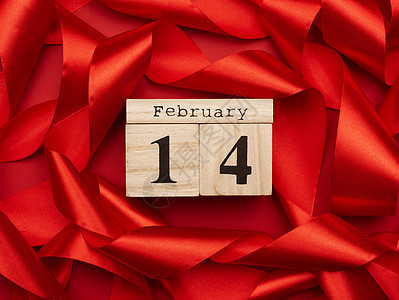 红色背景 有扭曲的红丝丝带 日期为14个february图片