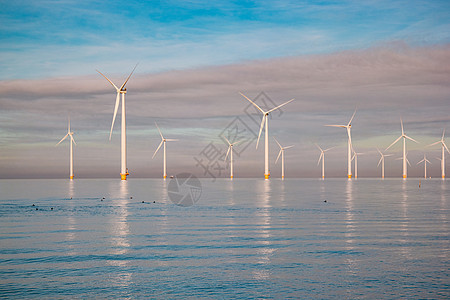 用于电力生产的风车荷兰弗莱福兰 海上风力涡轮机农场 生产绿色能源的风车农场全球生态螺旋桨力量蓝色技术环境旋转电气海洋图片