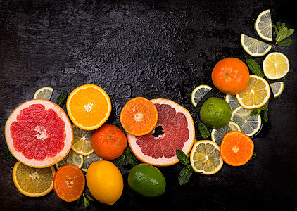 柑橘背景 新鲜的柑橘类水果柠檬 橙子 酸橙 葡萄柚在木制背景上乡村异国团体情调饮食热带树叶果汁叶子柚子图片