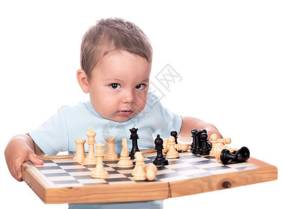 快乐的男孩与棋盘隔离在白色上图片