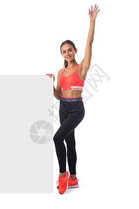 举起手臂的漂亮女孩广告训练广告牌微笑运动装活力身体运动横幅女士图片