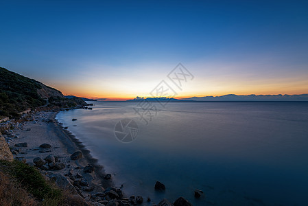 希腊 日落在海滩上海岸天堂阳光旅游太阳波浪海岸线蓝色海景天空图片