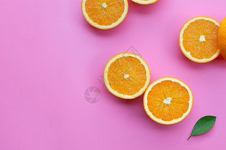 高维生素 C 多汁而甜美 粉红色背景中的新鲜橙色水果菠萝柠檬皮肤叶子排毒甜点食物热带植物团体图片