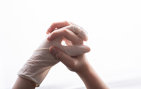 手与不育的乳胶保护手套连在一起 能帮上忙外联保健帮助护士职员医生服务卫生实验室生活图片