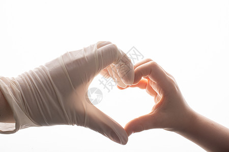 为保护而手戴保护手套 佩戴不育的乳胶防身手套护士医生病人实验室地球传染性流感外科预防职员图片