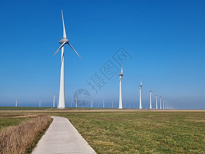 湖旁的风车村侵扰性风力厂生态绿色电气海洋发电机技术涡轮生产天空全球图片