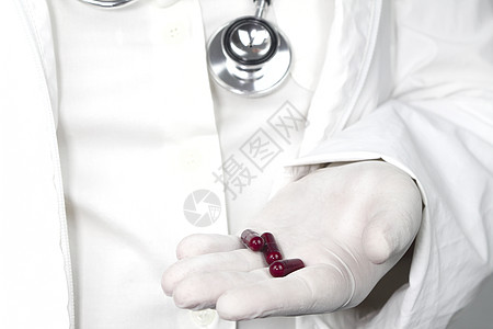 手持外科手套存放胶囊的医生药剂师抗生素预防病痛制药医院研究癌症药片乳胶图片