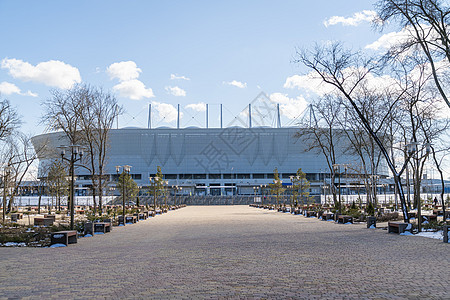蓝天背景的足球场体育场球场旅行运动员观众场地地面世界天线足球天空竞技场图片