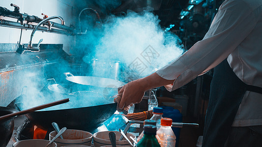 厨师做炒饭烹饪炒锅平底锅烧伤机器餐厅油炸餐饮厨房火炉图片