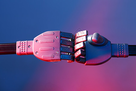 未来科技概念电子人男人合伙竞赛手臂技术商业机器人拳头机器图片