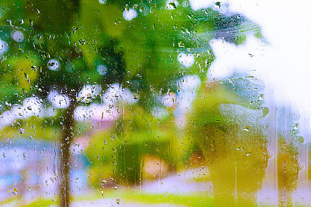 秋天与自然雨滴窗户雨天蓝色城市液体反射背景天气玻璃图片