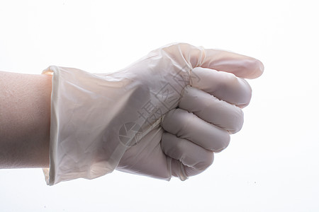 为保护而手戴保护手套 佩戴不育的乳胶防身手套地球实验室流感外科护士职员考试病人疾病橡皮图片