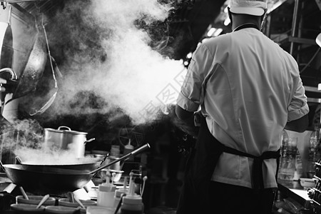 厨师炒饭忙着煮饭厨房餐厅平底锅职业火焰烧伤调子烹饪炒锅食物图片