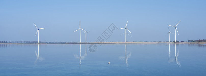 吉埃兰杜特奇省菲利布斯达姆附近水中反映的风风涡轮机反射海岸天空旅行生态活力日落旋转农场海洋图片