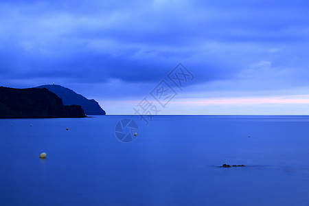 日出在西班牙南部的海滩上村庄假期地平线蓝色卡波天空日落太阳橙子热带图片