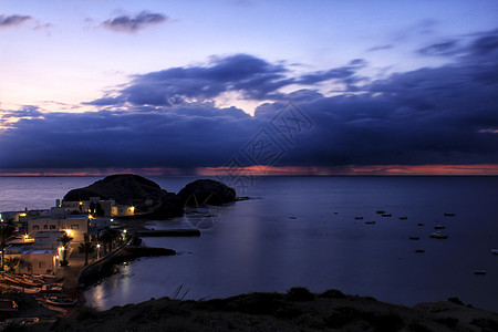 西班牙村海滩日出季节海洋小岛海岸热带地平线假期旅行场景晴天图片