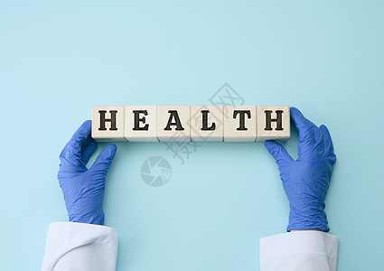 两只雌性手握着木板 将健康记录在蓝色背景上 健康的生活方式概念是健康的图片