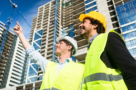 大型建筑工地建筑设计师的指令说明工人访问安全帽意外工程师合伙职业进步头盔工程图片