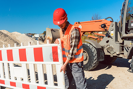 建立土工建筑工地的工人工作栅栏道路勃起击剑商业施工职业橙子标志图片