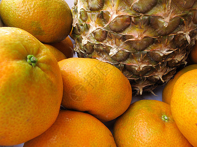 新鲜菠萝橘子橙子杂货店热带情调水果叶子营养市场收成饮食图片