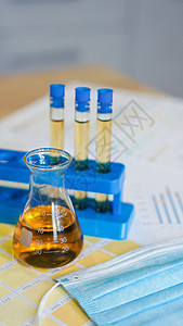 在医疗彩色图案上配有尿液的瓶状和试验管及试管控制化学图表尿检化学品治疗医生酒精药品塑料图片