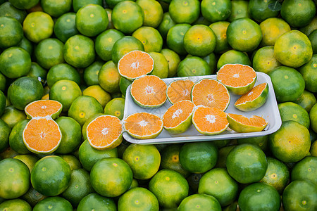 刚摘到的绿色橘子红番茄 柑橘 柑橘 柑橘食物饮食柑桔树叶果汁水果收获橙子热带生长图片