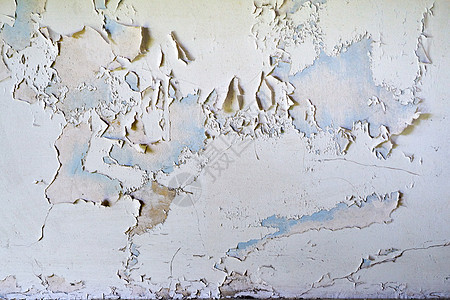 墙上开裂和剥落的油漆细节图片
