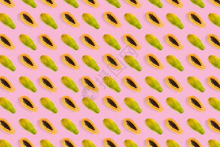 粉红色背景上新鲜成熟的木瓜背景 热带抽象背景 顶视图 现代的水彩蓝色纺织品艺术橙子绿色种子果汁墙纸丛林图片