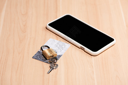 信用卡和手机上锁闭锁安全互联网信用交易键盘钥匙货币水平银行业挂锁图片
