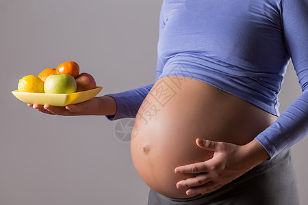 怀孕妇女生果肚子的孕妇图片