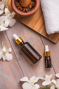 瓶装香气基本油或温泉和天然香味油肥皂桌子治疗师瓶子生活兰花白色疗法身体芳香图片