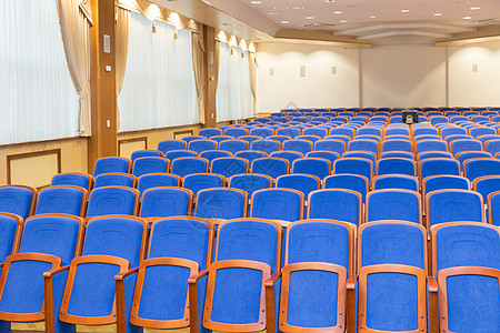 带有蓝色座位的会议厅椅子展示观众推介会国会剧院大厅民众训练商业图片