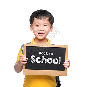 年轻的年青男孩笑笑着 紧抱着SHCOOL黑板学生微笑教育男性童年幼儿园老师孩子们男生绿色图片