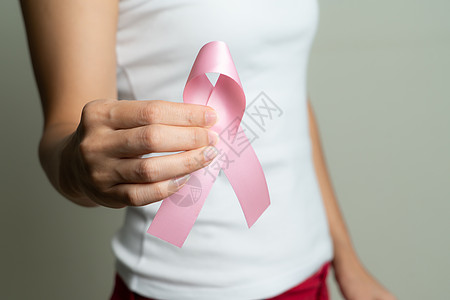 女性手握着粉色丝带乳腺癌意识疾病癌症世界丝带考试治疗预防身体药品外科图片