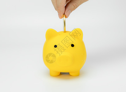 手工在小猪银行存钱安全财富订金工作室商业手指经济存钱罐货币金子图片