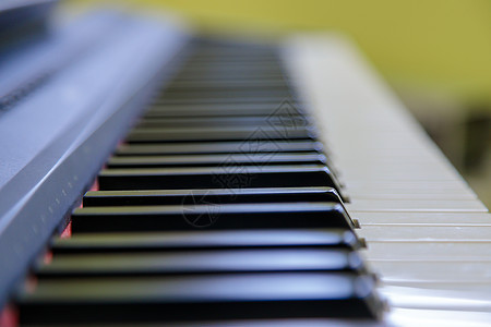 黑白电子钢琴键 特写象牙创造力音乐韵律白色黑色旋律声学选择性艺术背景图片