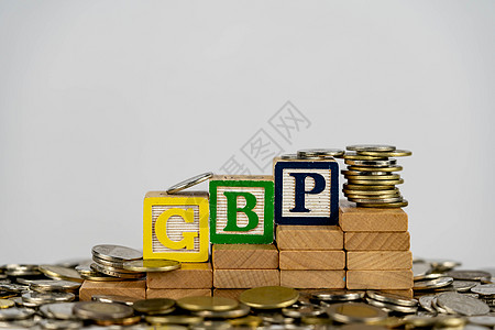 外汇 GBP 概念与木块和硬币 木块上的 Forx GBP 字母被货币包围力量金融市场利润生长股市数据控制板展示投资图片
