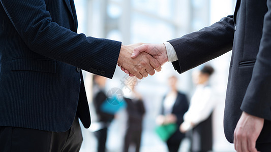 工商界人士的握手男性合伙交易友谊同事商业团体伙伴商务问候语图片