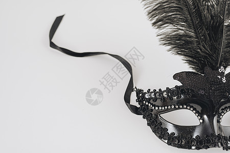 带羽毛表的黑色狂欢节面具 高品质照片图片