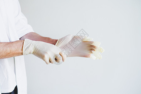 医生的手戴着医疗手套科学护士疾病松紧带人员药品化学家橡皮外科前线图片