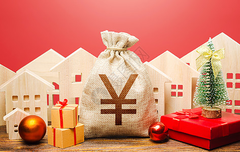 新年背景下的元元钱袋和房屋 增加投资吸引力 繁荣 促销 优惠 新年或圣诞节寒假 抵押贷款 银行存款 信用背景
