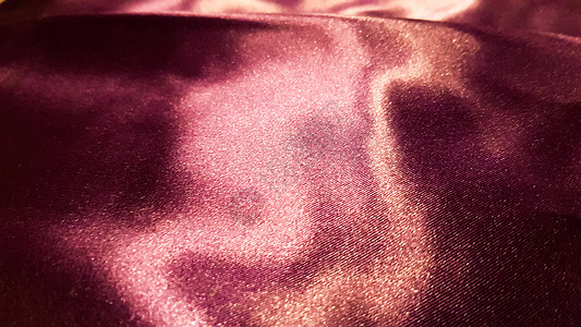 紫色织物特写背景 光滑优雅的丝绸或缎子质地可以用作背景 抽象布织物 织物背景编织波纹奢华曲线亚麻装饰涟漪风格纺织品材料折叠图片