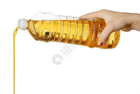 油背景从塑料瓶里倒食用油的女人手 孤立于白种人背景中烹饪食物塑料玉米液体大豆养分瓶子女性蔬菜背景