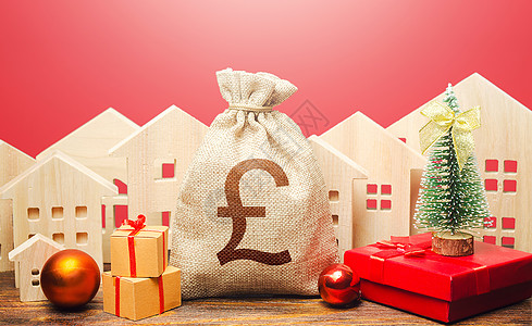 英镑钱袋和新年背景下的房屋 新年或圣诞节寒假 提高投资吸引力 促销 优惠 抵押贷款 银行存款图片