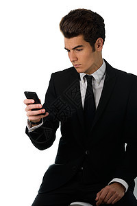 英俊的商务人士在用手机说话 在白色背景上被孤立图片