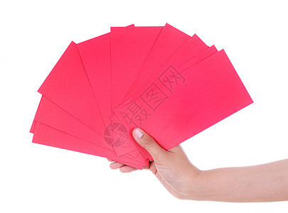 手握红色红包 意思是中国幸福新年与白背景隔绝白色文化传统祝福庆典节日战俘礼物信封假期图片