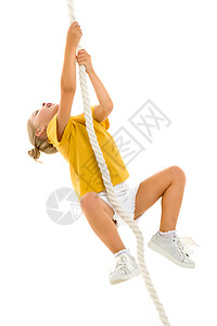 一个小女孩用手抓住绳子 挥舞着绳子运动游戏快乐孩子活力跳绳喜悦活动女性童年图片