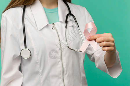 女性医生手握乳腺癌认识粉色丝带Pink絲带丝带国家预防疾病考试检测照片斗争木头诊断图片